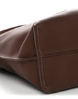 X SUNA FUJITA Nappa Flamenco Knot Clutch Havana