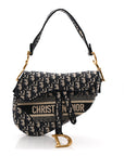 Oblique Embroidered Saddle Bag Blue