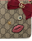 GG Supreme Monogram Face Embroidered Wrist Wallet Pink